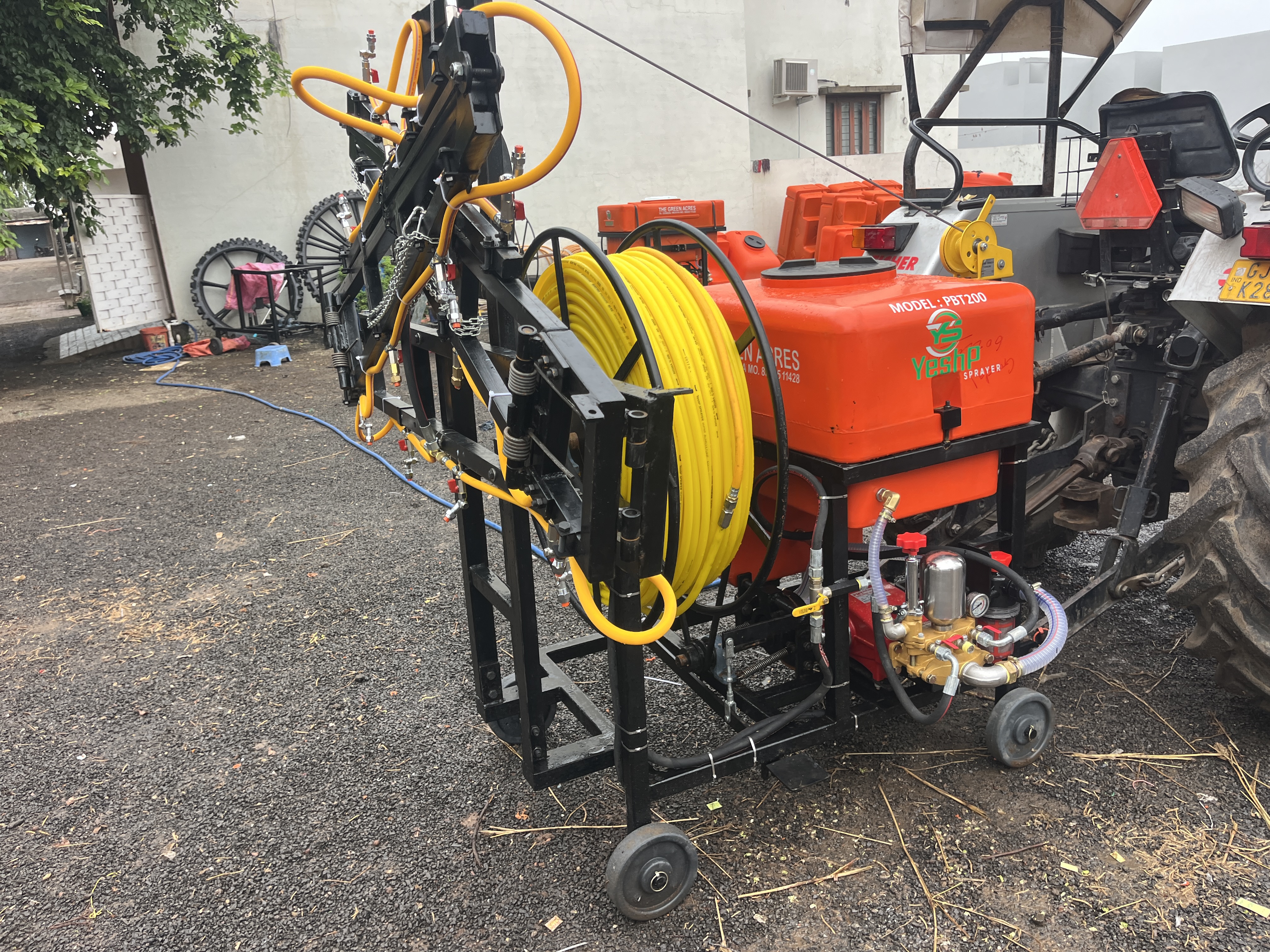 YeshP Sprayer mounted on its trolley and hitched to a tractor